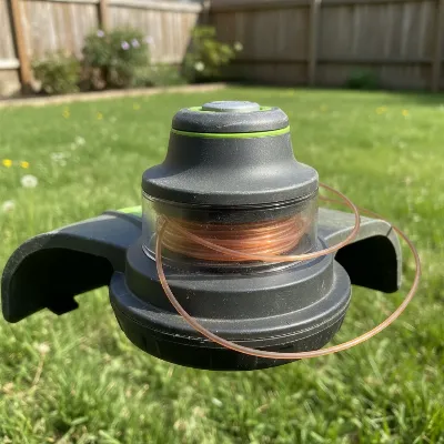 EGO Power+ 15-inch string trimmer Powerload head demonstrating automatic line winding